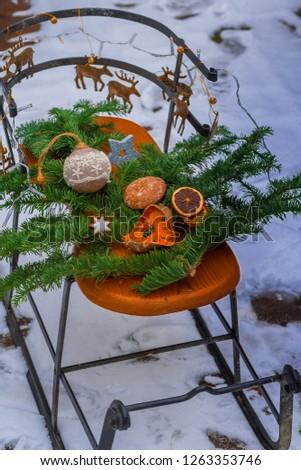 sleigh with winter decoration in the snow 