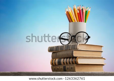 Chalkboard with stack book Royalty-Free Stock Photo #1263362761