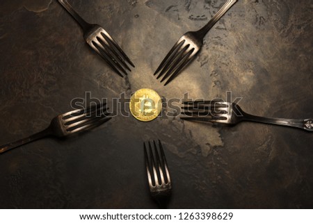  golden bitcoin with silver forks 