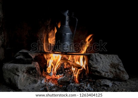 boiling water on a fire