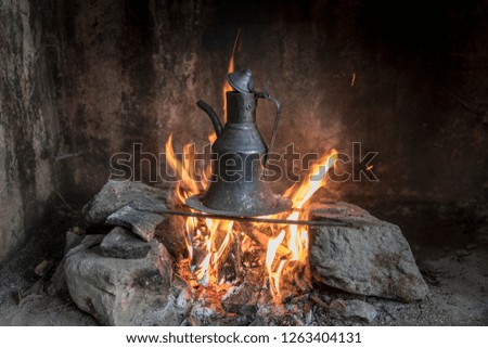 boiling water on a fire