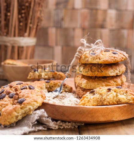 Biscuit biscuits with chocolate drops. Healthy homemade pastries. Photo in rustic style, food on wooden background. Free space for text
