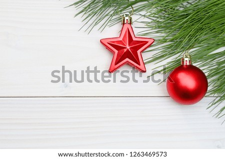 Christmas and New Year trees branch and red star,red ball  on a white wooden background.Mockup & Flat Lay.