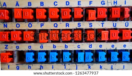 abc stemplae colorful letters for school and children to teach alphabet. nice background with blue and red colors and wood