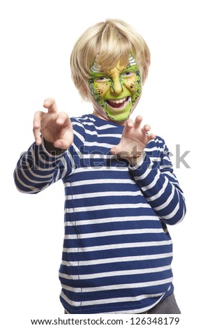 Young boy with face painting monster smiling on white background