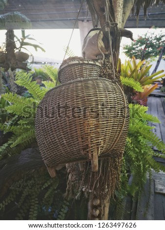 a bamboo container for caught fish, a fishtrap