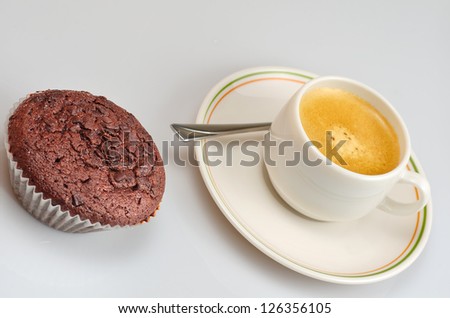 picture of a chocolate cupcake and a coffee