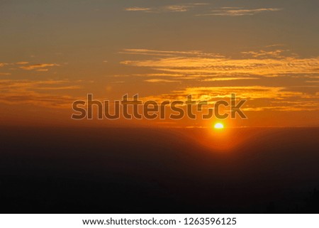 Shadow image,Beautiful views of the sunrise in the morning on the horizon make the sun and the bright orange light of the sun look bright and beautiful.
Golden light of the sun in the morning