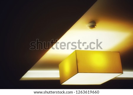 light square lamp and smoke detector on ceiling