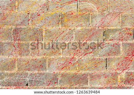 Concrete block wall background and texture.Colorful Concrete block wall as background,color painting on concrete  block  wall .Dropping acrylic paint on the concrete wall.Street art - graffiti.