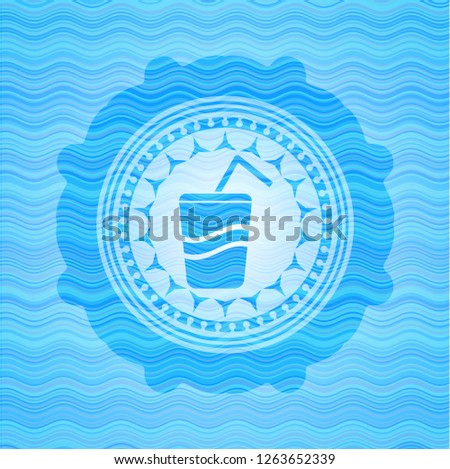 soda icon inside sky blue water wave badge.