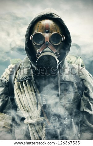 Environmental disaster. Post apocalyptic survivor in gas mask Royalty-Free Stock Photo #126367535