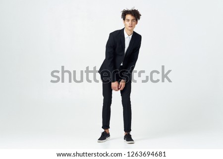 Curly guy in a classic suit                         