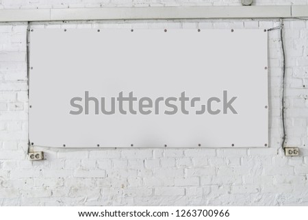 White banner on white brick wall as a good mock up for design