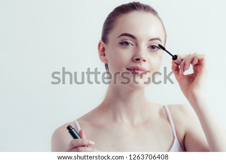 Mascara woman putting makeup beauty healthy skin 