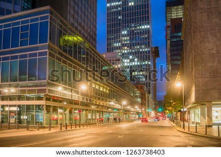 Evening cityscape with car traffic on illuminated street of Frankfurt am Main in dowmtown, Germany