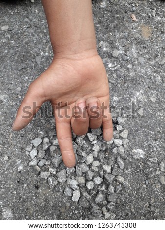 Love hands sign on road background
