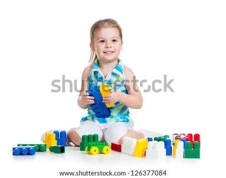 kid girl with construction set toy over white background