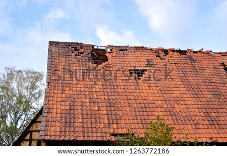 Roof destroyed after a storm Royalty-Free Stock Photo #1263772186