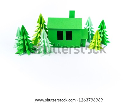 Green house paperwork standing on a white background. Paper craft. Forest christmas tree. Children's crafts handmade.