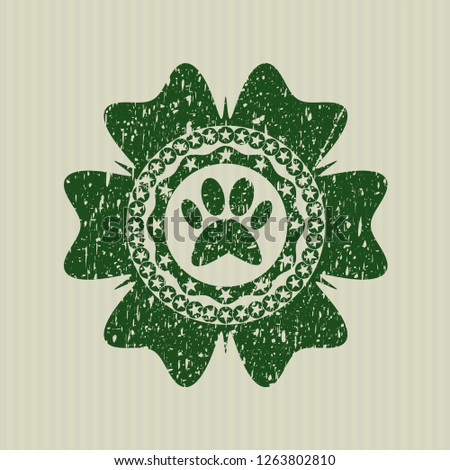 Green paw icon inside grunge stamp