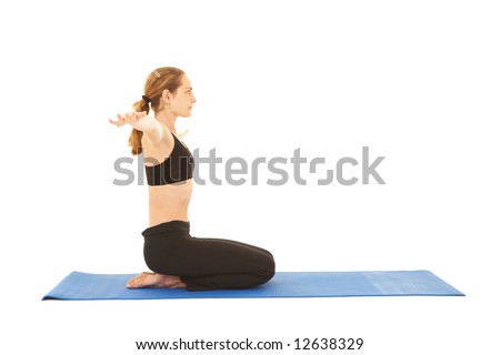 Fit young brunette pilates instructor showing different exercises on a white background a blue yoga mat. White background NOT ISOLATED