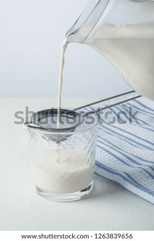 fresh milk in glass jug and glass