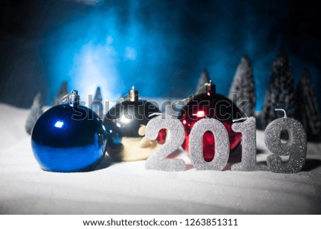 Christmas background with baubles, on snow, free space for text. Christmas decoration. Festive background