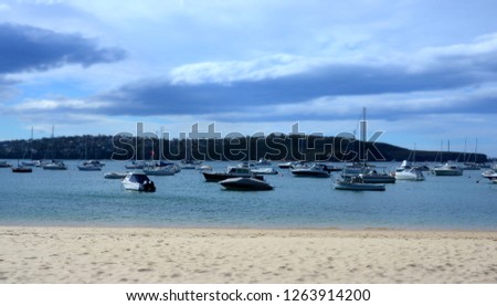 A collection of yachts and cruisers at their floating moorings at Balmoral beach near Mosman in Sydney Harbour.