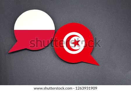 Poland and Tunisia flags with two speech bubbles on dark gray background