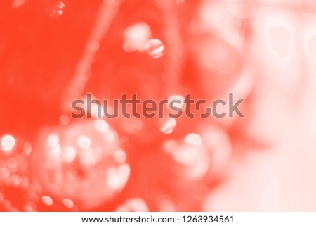 Bright abstract living coral background with blurred lights.