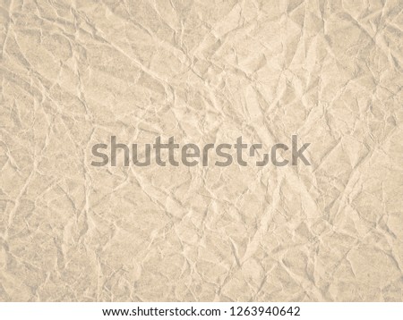 Texture of beige crumpled craft paper. Texture for design, abstract background