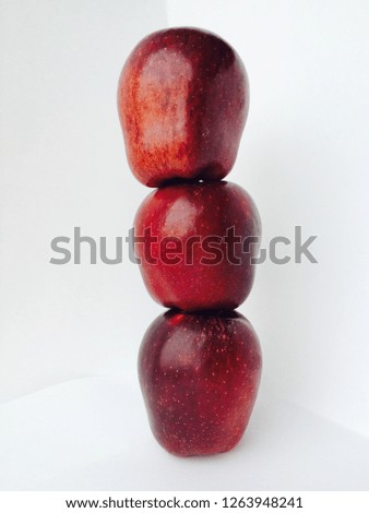 Three red apples fresh fruits put into zen pyramid. Fresh fruit balance