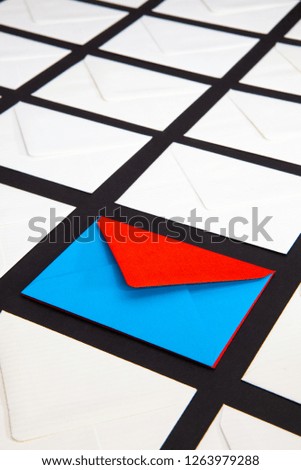 Composition with white and two-color envelopes on the table. The photo suitable for various holidays and anniversaries.