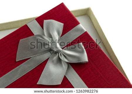 Open Red gift box with bow on white background. Close up