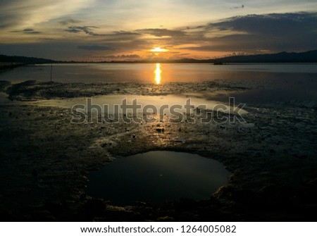 Sunrise and a shallow bay