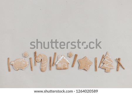 Christmas homemade gingerbread cookies in the line on craft paper background. Christmas bakery banner