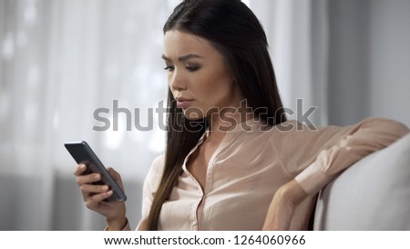 Concerned girl having issues with outdated app, unsatisfied with phone software