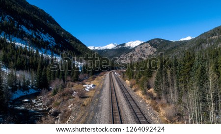 Aerial view of train tracks in the Colorado mountains