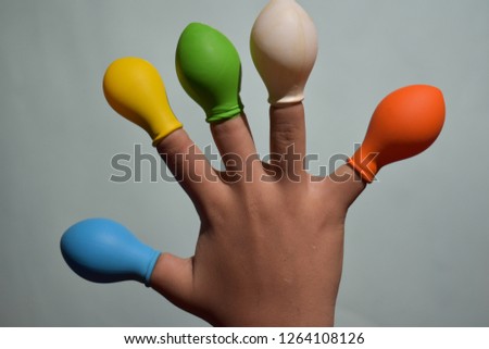Balloon on finger or kids wearing balloon on fingers 