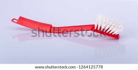 Plastic cleaning brush on white background