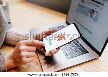 Woman with phone. Online payment. Women hands using smartphone and laptop computer for online shopping. Payment Detail page display. Royalty-Free Stock Photo #1264175764