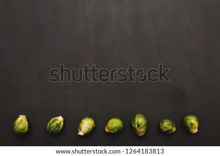 Fresh Brussels sprouts on black background stock image