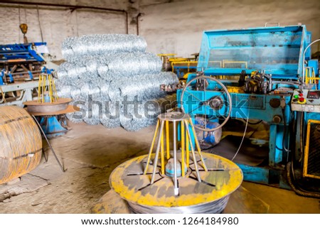 Metal rolling industrial workshop. Craftsmen working on metal rolling machines. Industrial modern technology.Technological work on the production of metal structures.Working atmosphere with copy space