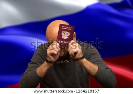 Detained in handcuffs Russian citizen with a passport in his hands
