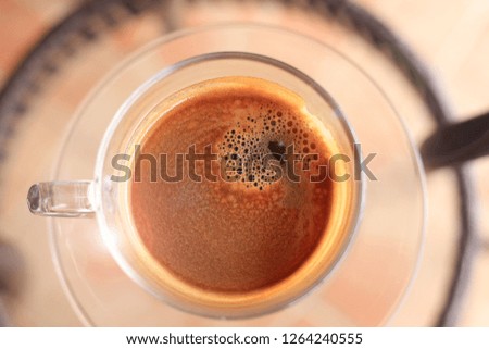 Close-up of black coffee in a coffee cup selective focus and shallow depth of field