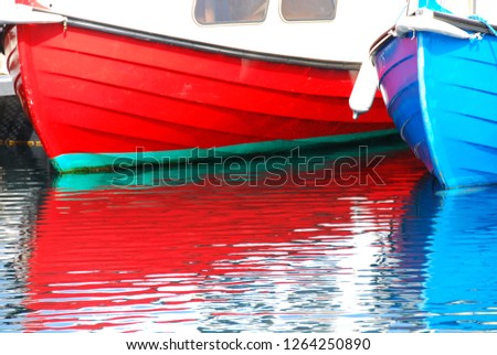 Blue & Red boat reflexion on the water