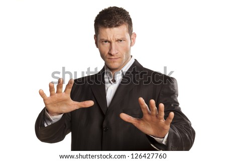 serious businessman with stop placed hands on white background