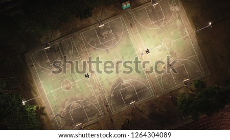 Aerial view with basketball court. Drone shot. Royalty-Free Stock Photo #1264304089