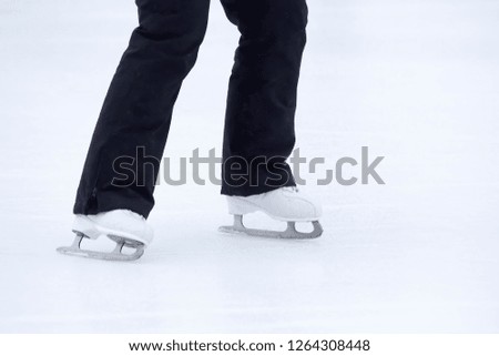 feet rolling on skates woman on the ice rink